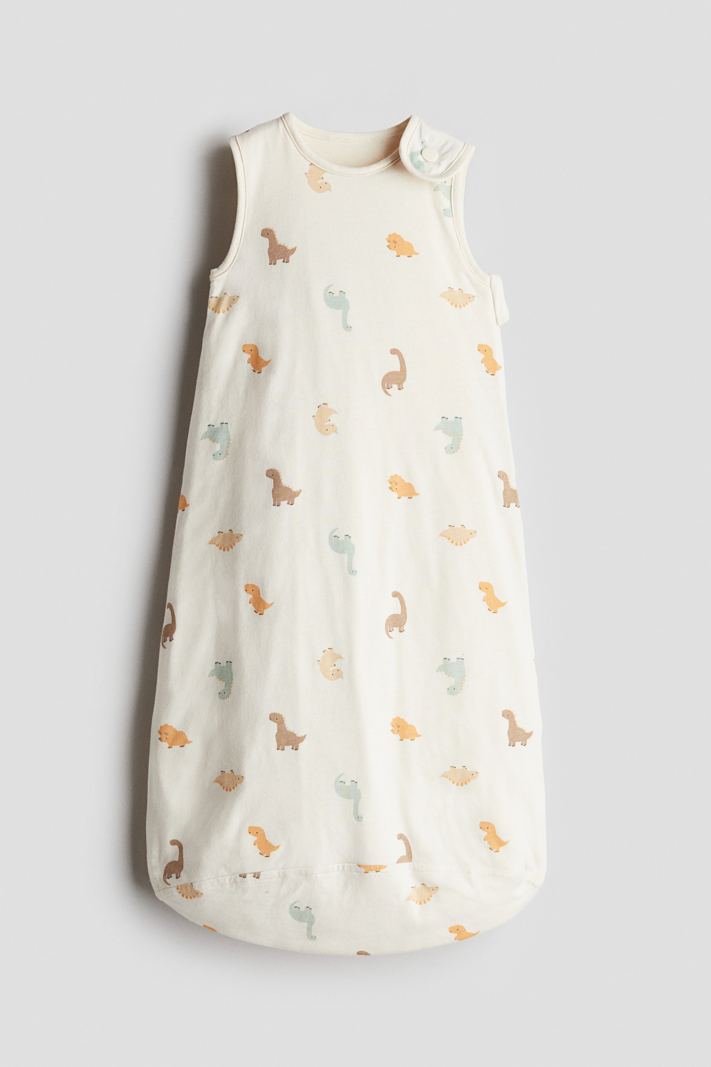 Patterned sleep bag — Cream/Dinosaurs